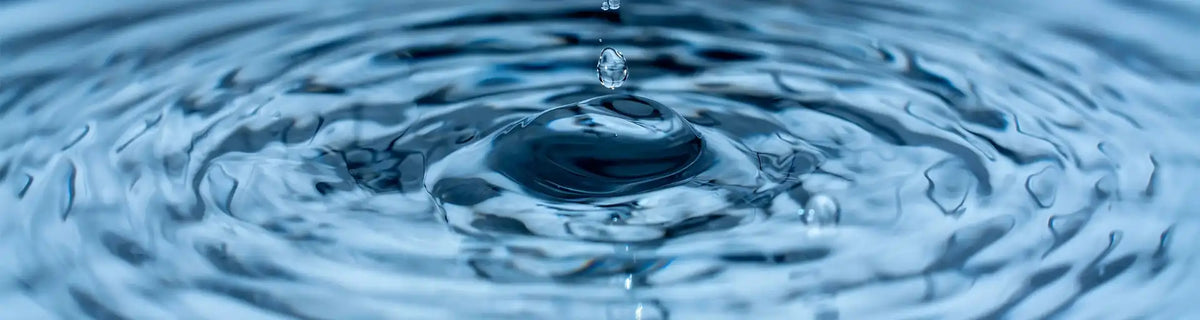 Water element banner: drop of water sending ripples representing purification